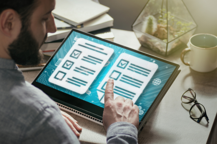 Man looking at tablet. Exam items on screen.