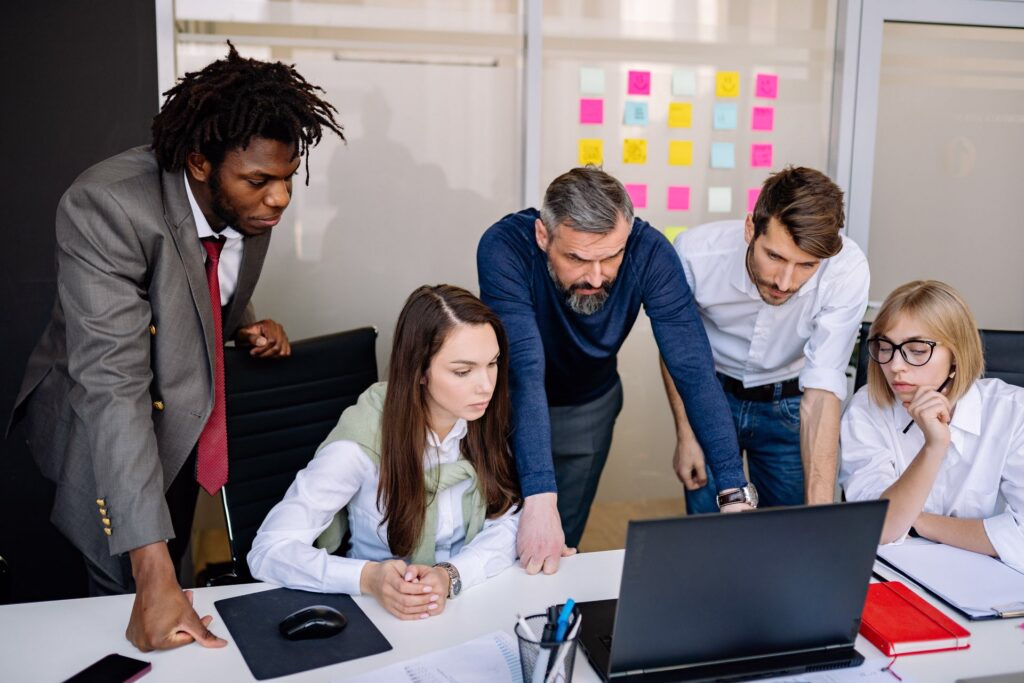 Technology professionals collaborating on an enterprise certification program